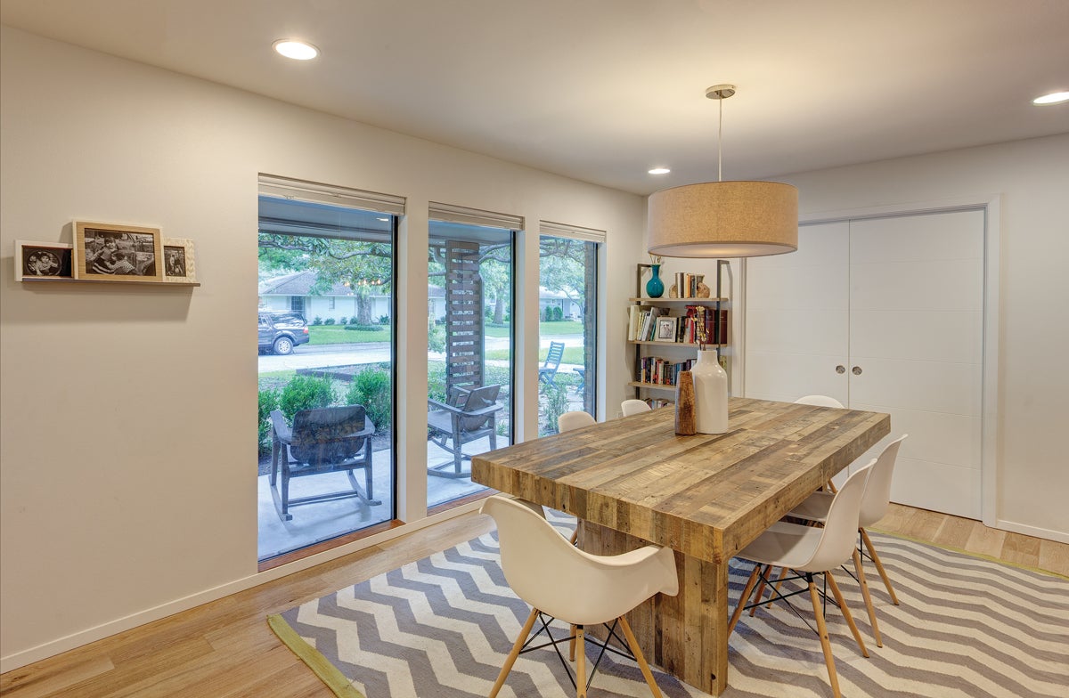 Dining room area with large aluminum windows
