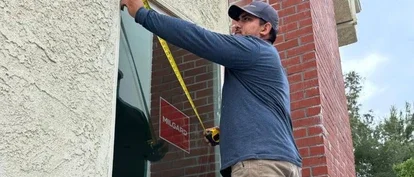 Milgard Installation with man measuring window with tape measure