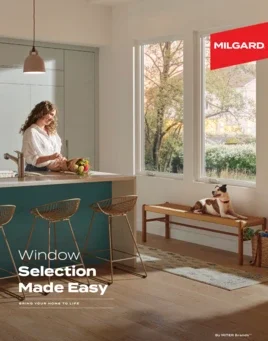 Cover of a MILGARD brochure with a woman standing at a kitchen island. To the right, two large windows looking outside. Text overlaying in bottom left corner reading 'Window Selection Made Easy.'