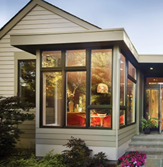 Exterior of home showing bronze window combinations