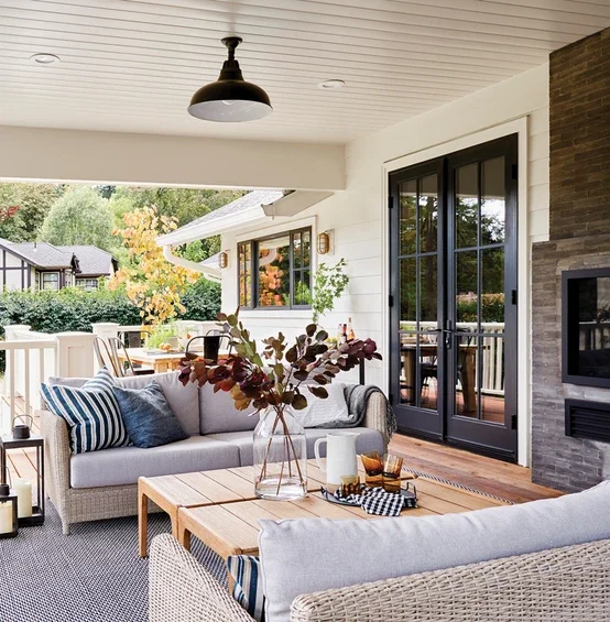 Back patio of home facing black outswing patio doors