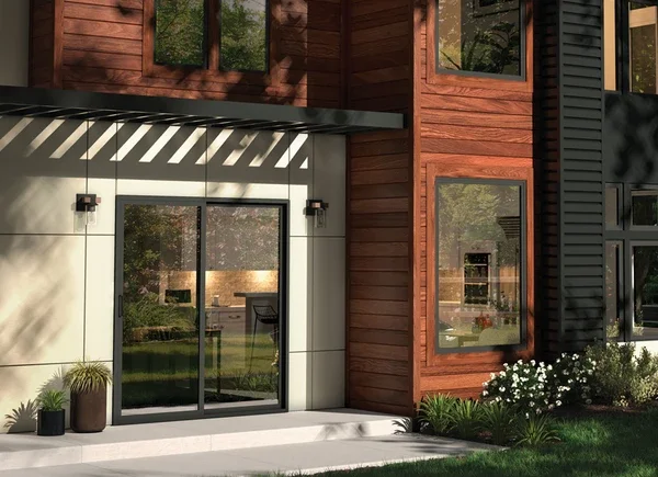 Exterior of home showing detailed door and black windows 