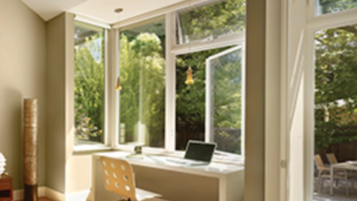 Office Space looking at white casement windows