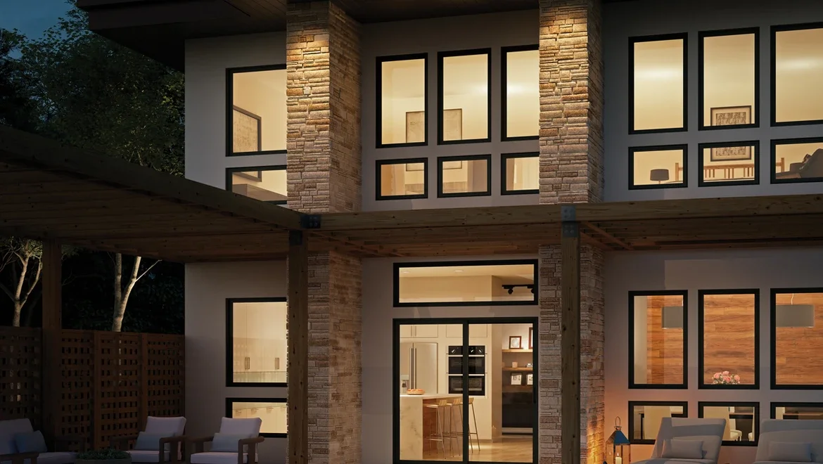 Two story home at dusk. You can see the lights in the house are on with black V300 windows and doors.