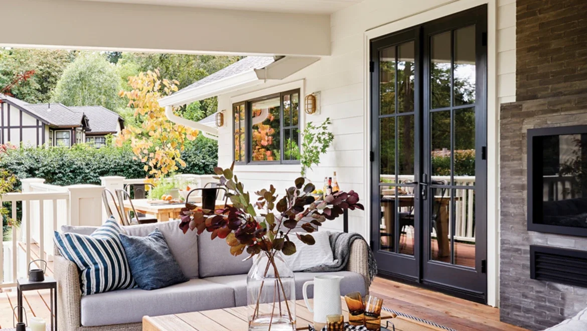 Back patio of home facing black outswing patio doors