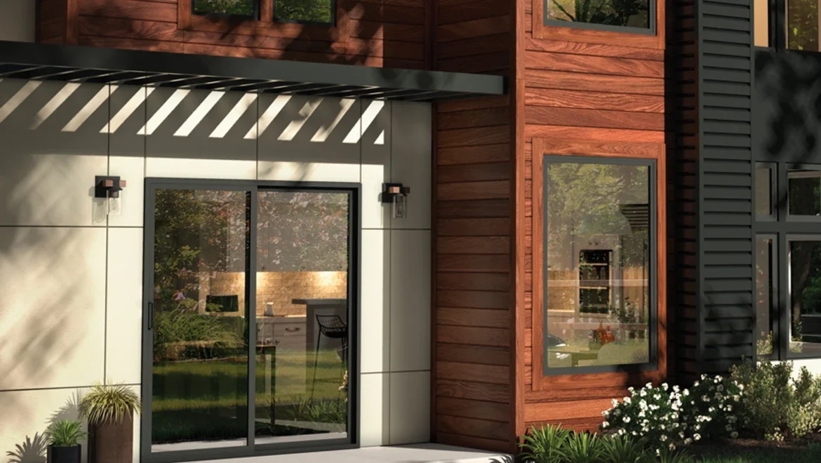 Exterior of home showing detailed door and black windows 
