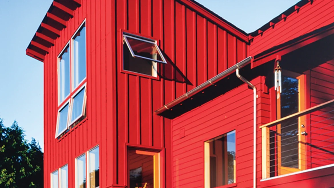 Exterior farmhouse style house with awning windows