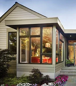 Exterior of home showing bronze window combinations