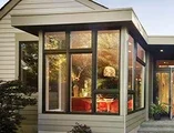 Exterior of home showing bronze window combinations
