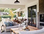Back patio of home facing black outswing patio doors