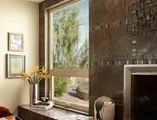 Living room facing window with tiled hearth  