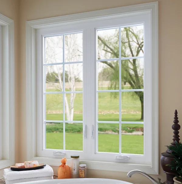 Bathroom facing white casement windows