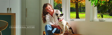 Woman sitting infront of windows on a bench with a dog. Text overlay reads promotional image.