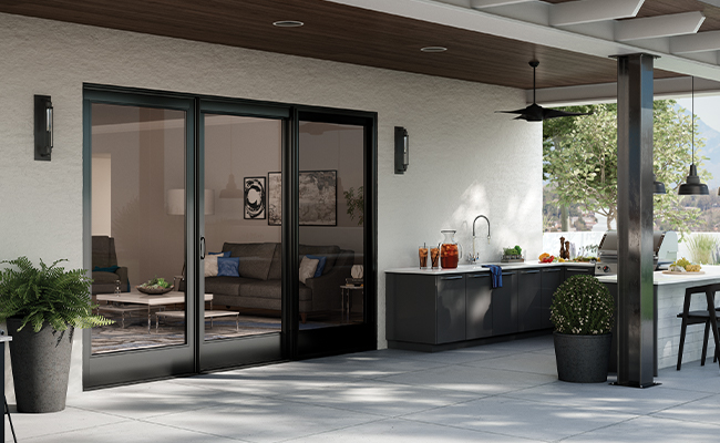C650 | Ultra Series Black Bean Sliding Glass Door Exterior View with Pergola and Grill Area