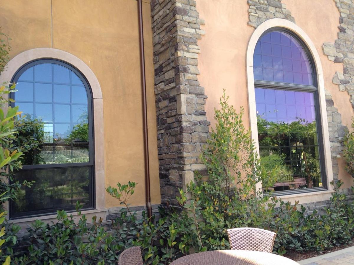 side of old winery with replacement windows