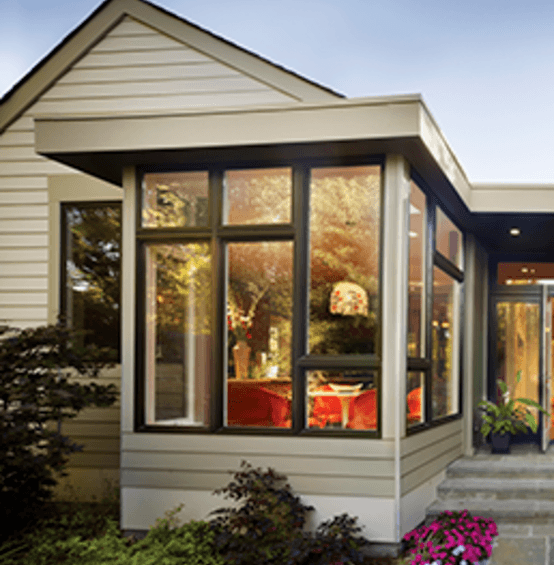 Exterior of home showing bronze window combinations