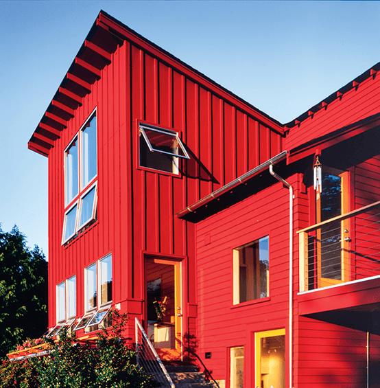 Exterior farmhouse style house with awning windows