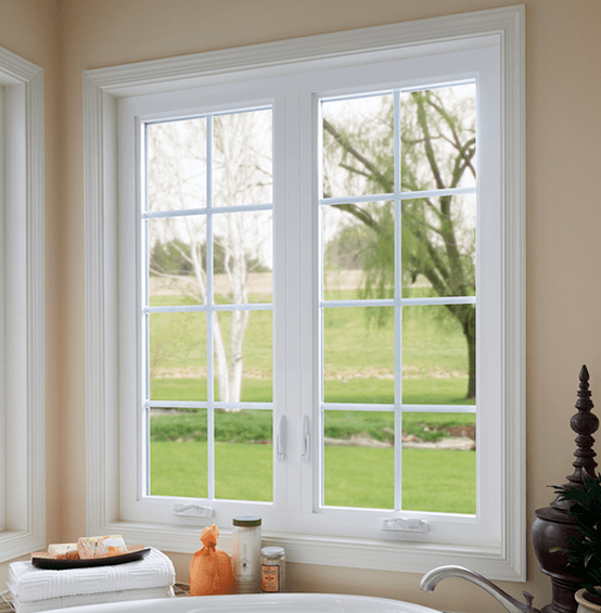 Bathroom facing white casement windows