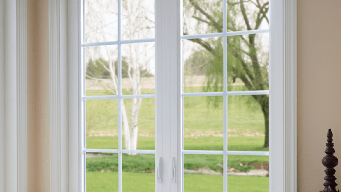 Bathroom facing white casement windows