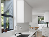 Modern white kitchen with black awning window