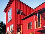 Exterior farmhouse style house with awning windows