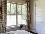 Bedroom facing casement windows