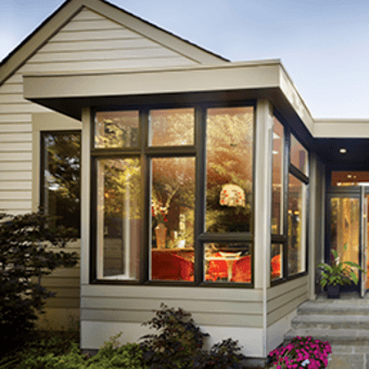 Exterior of home showing bronze window combinations