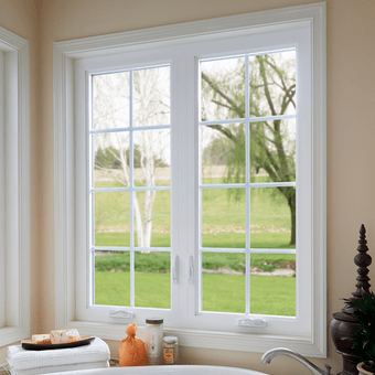 Bathroom facing white casement windows