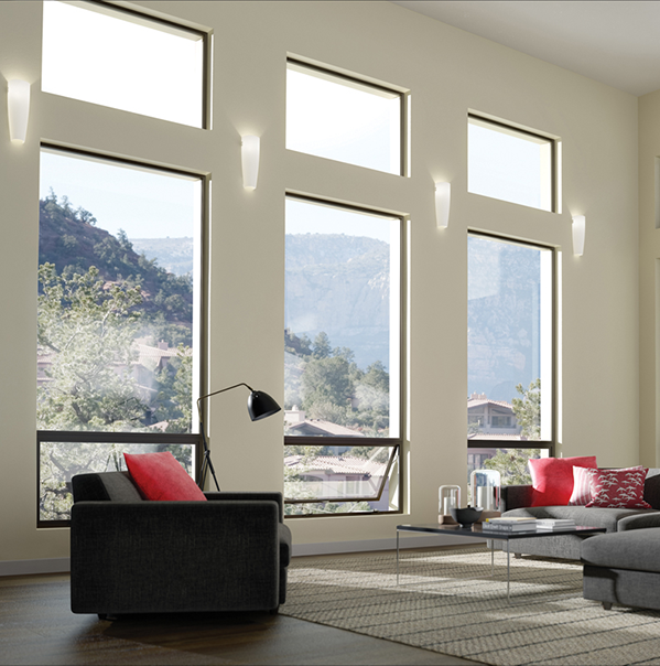 Modern living room facing towards aluminum picture and awning window combintations