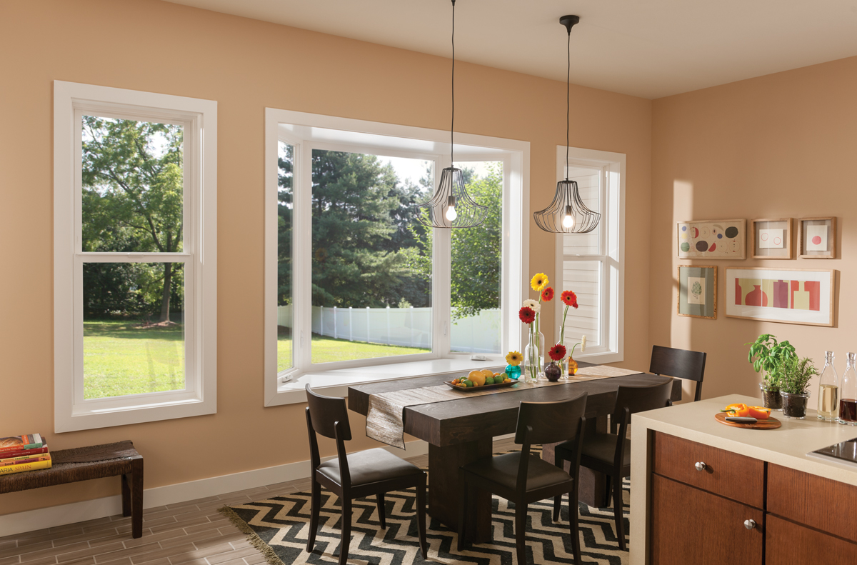 Dining Room area with Tuscany® Series | V400 white bay window and white single hung windows