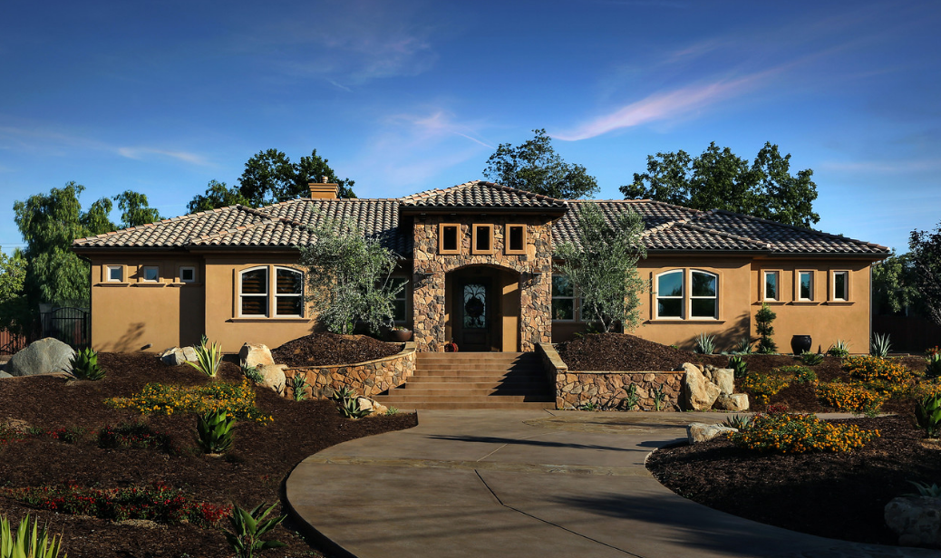 Traditional home with tan painted vinyl windows