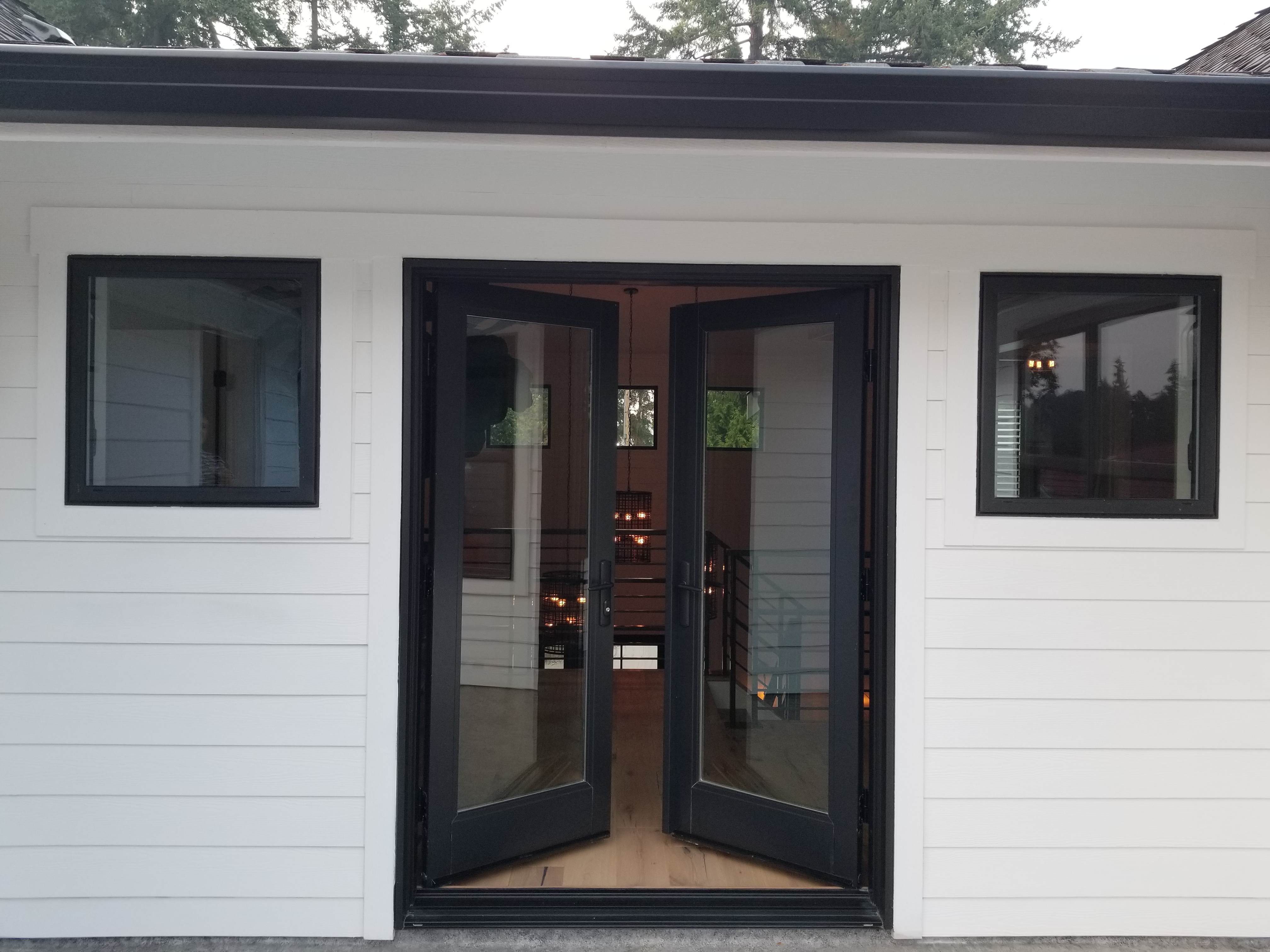 Inswing fiberglass patio doors in the color Black Bean