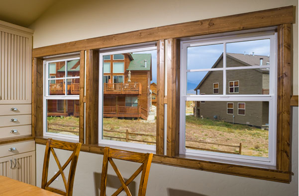 Interior shot of Tuscany Series Vinyl windows in dining room area.