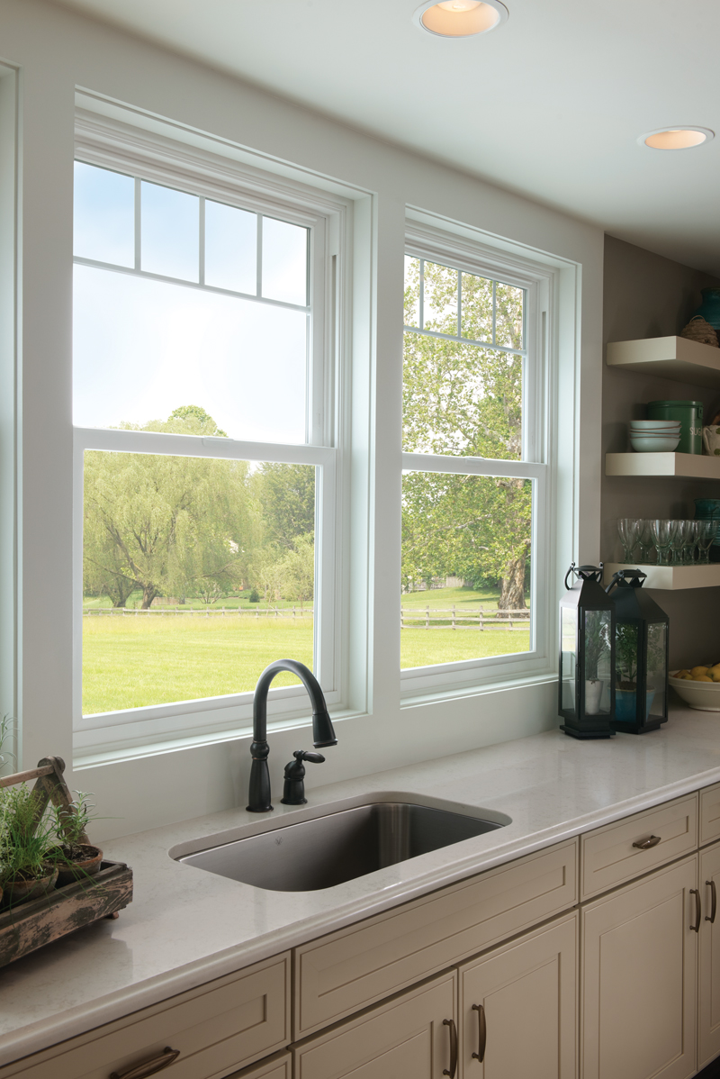 Tuscany® Series white vinyl windows with valance grids.  