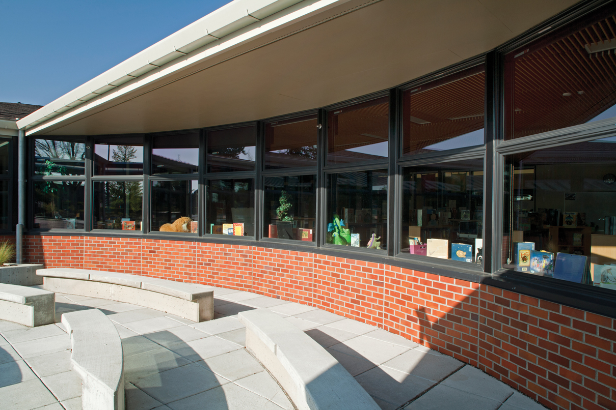 Exterior of school house with replacement windows