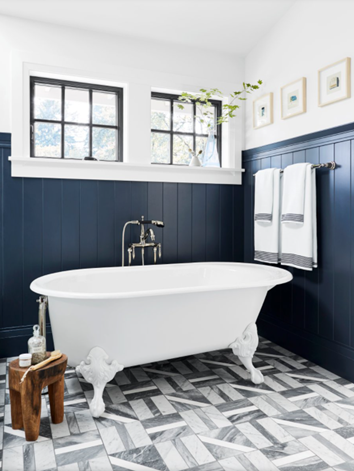 Milgard Ultra Series C650 windows in black bean with colonial grids in bathroom above clawfoot tub and dark blue board and batten
